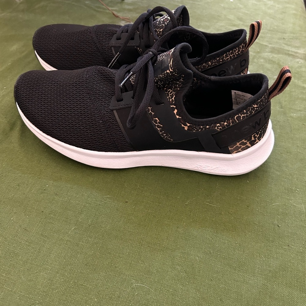 New balance tennis shoes black and leopard
